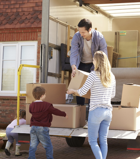 Family moving into a new home with boxes